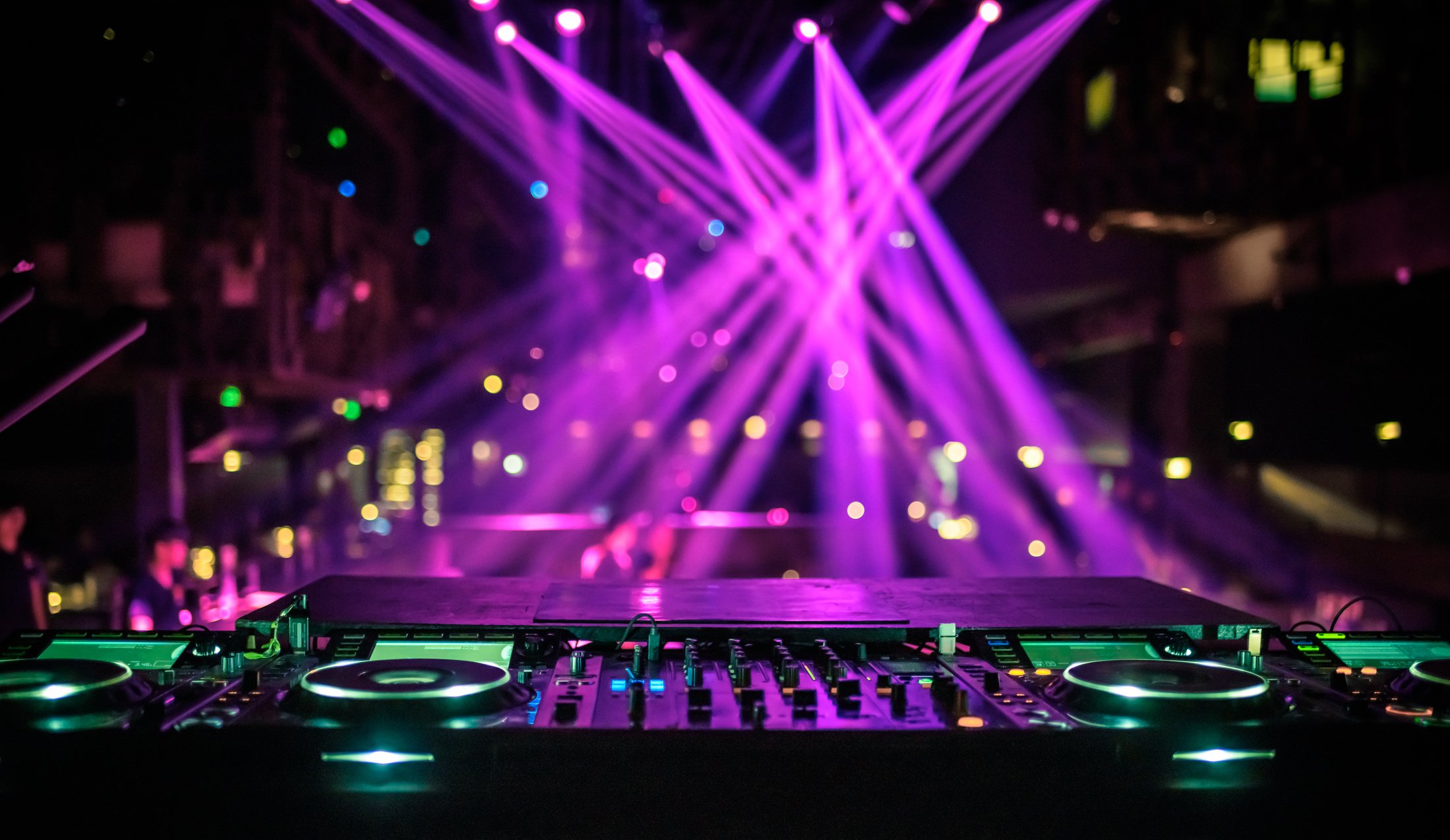 DJ console mixing desk at a night club